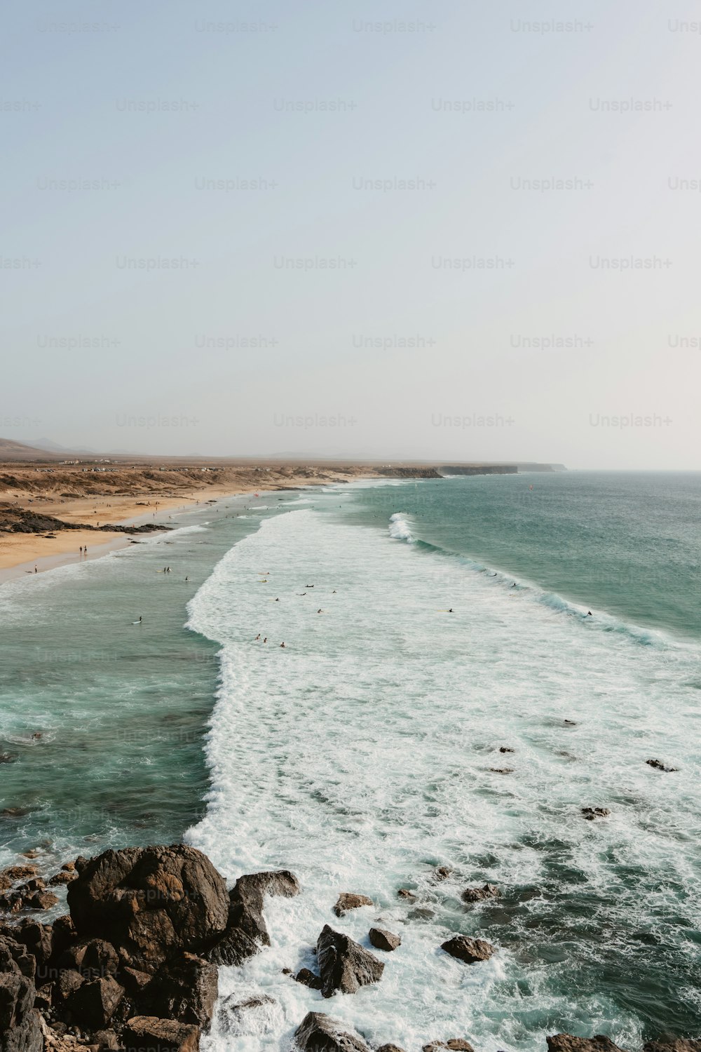 a view of the ocean from a rocky cliff