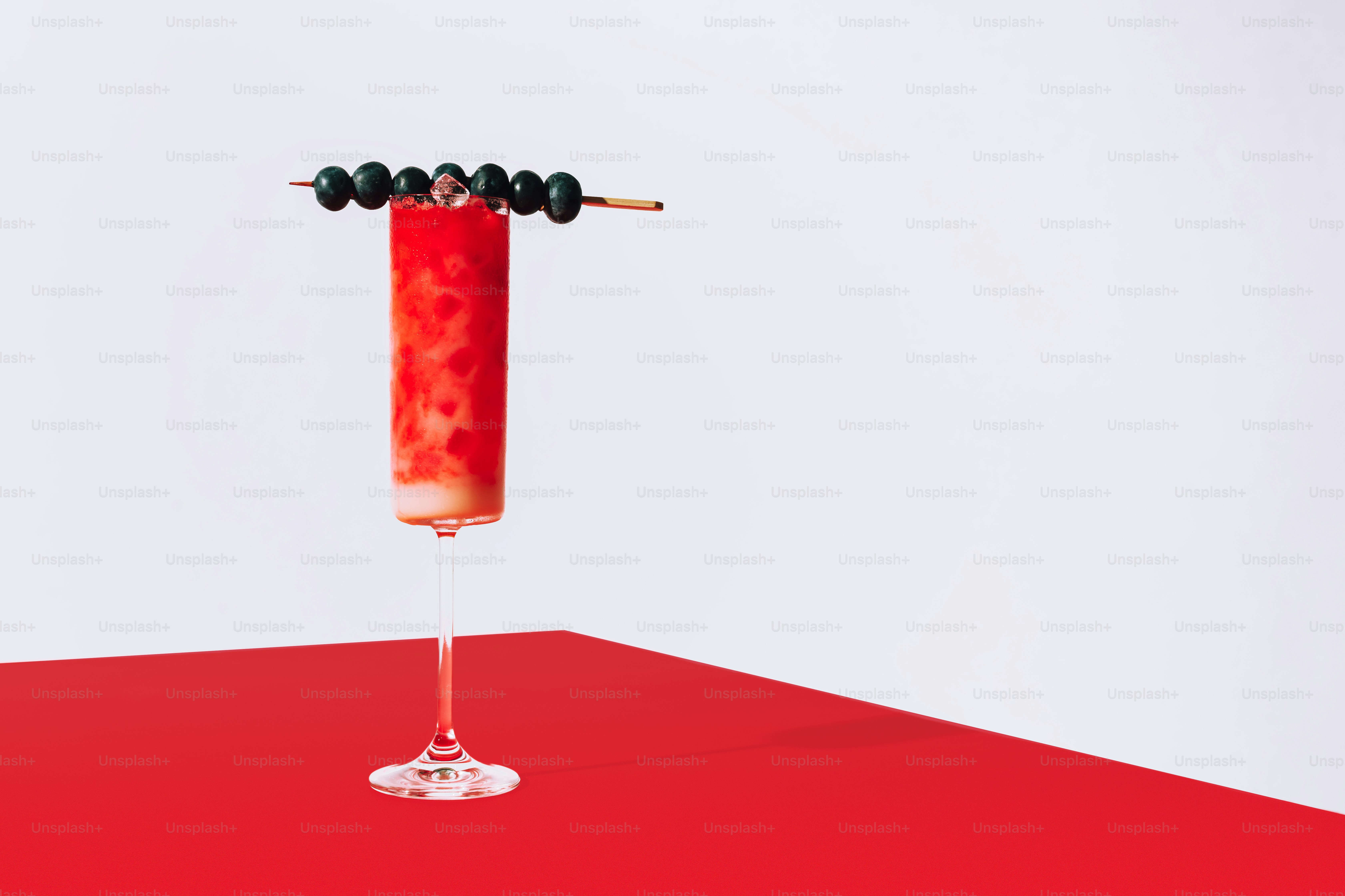 a wine glass with a red substance in it