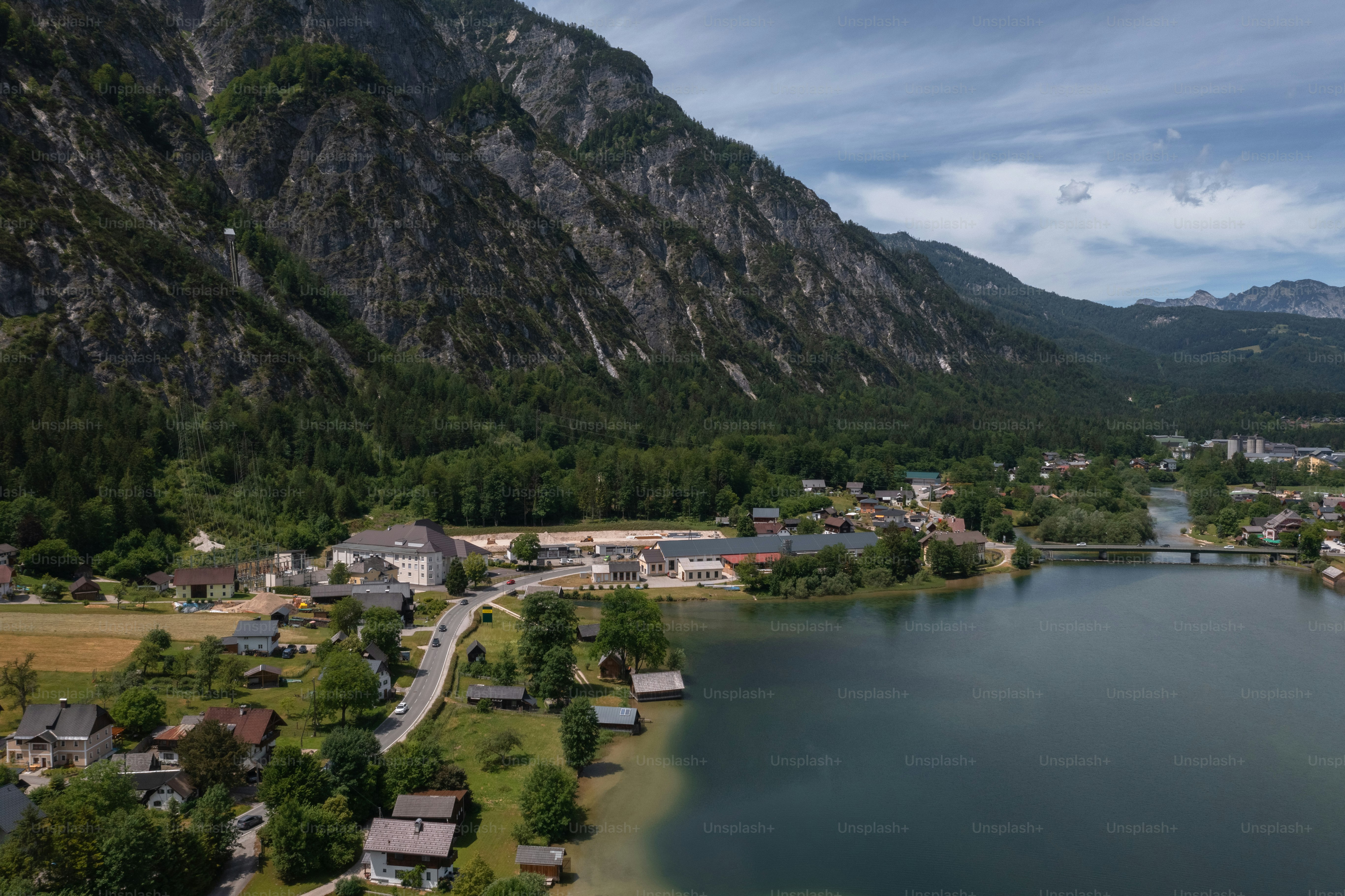 an aerial view of a small town by a lake