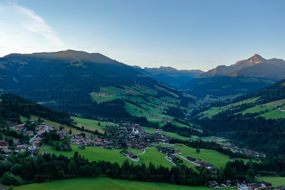 a scenic view of a village in the mountains