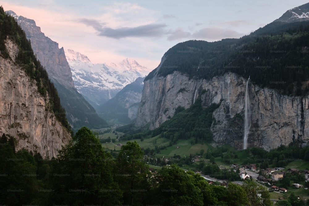 a view of a valley with mountains in the background