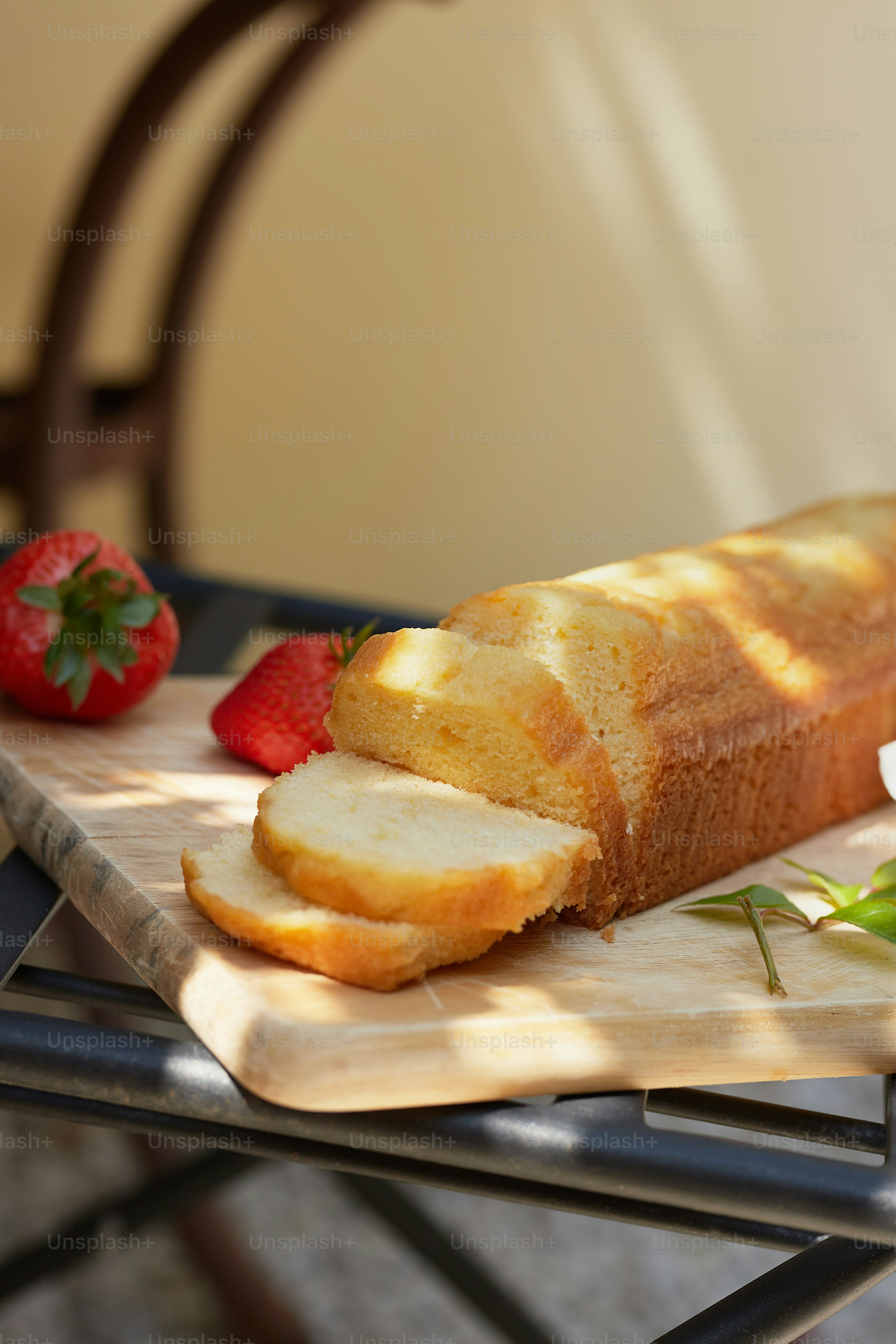 a loaf of bread sitting on top of a wooden cutting board