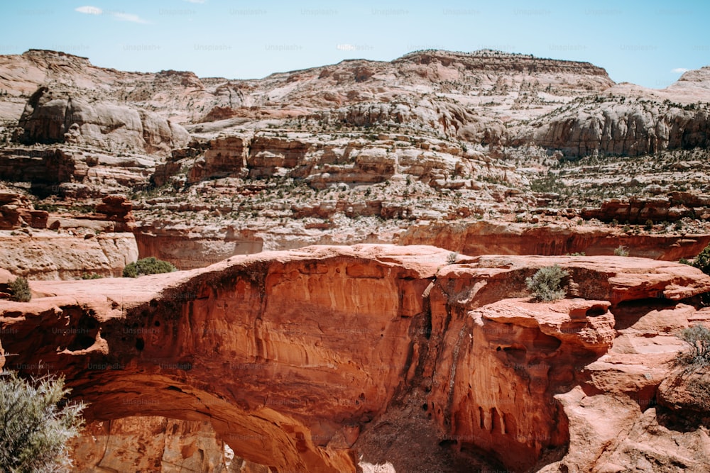 a large rock formation in the middle of a desert