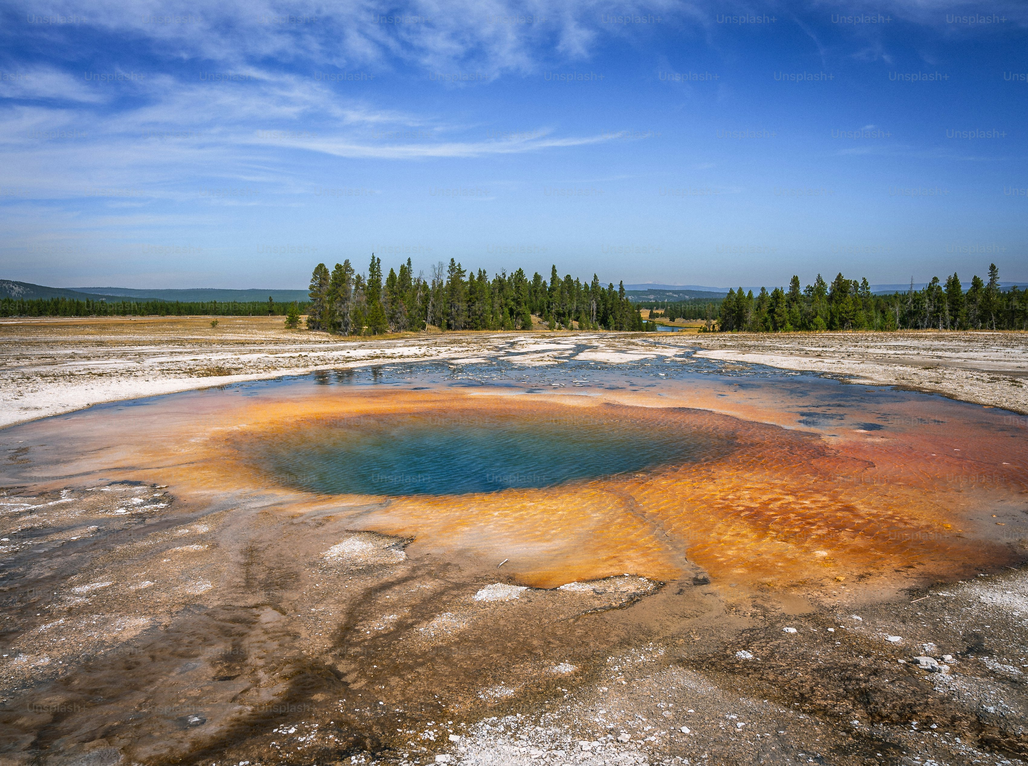 a large blue hole in the middle of a field