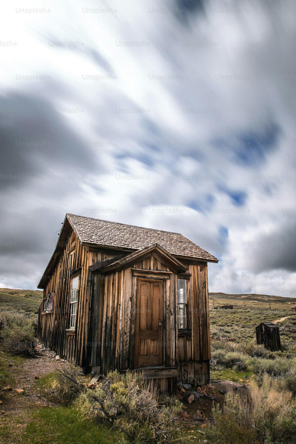 an old outhouse in the middle of nowhere