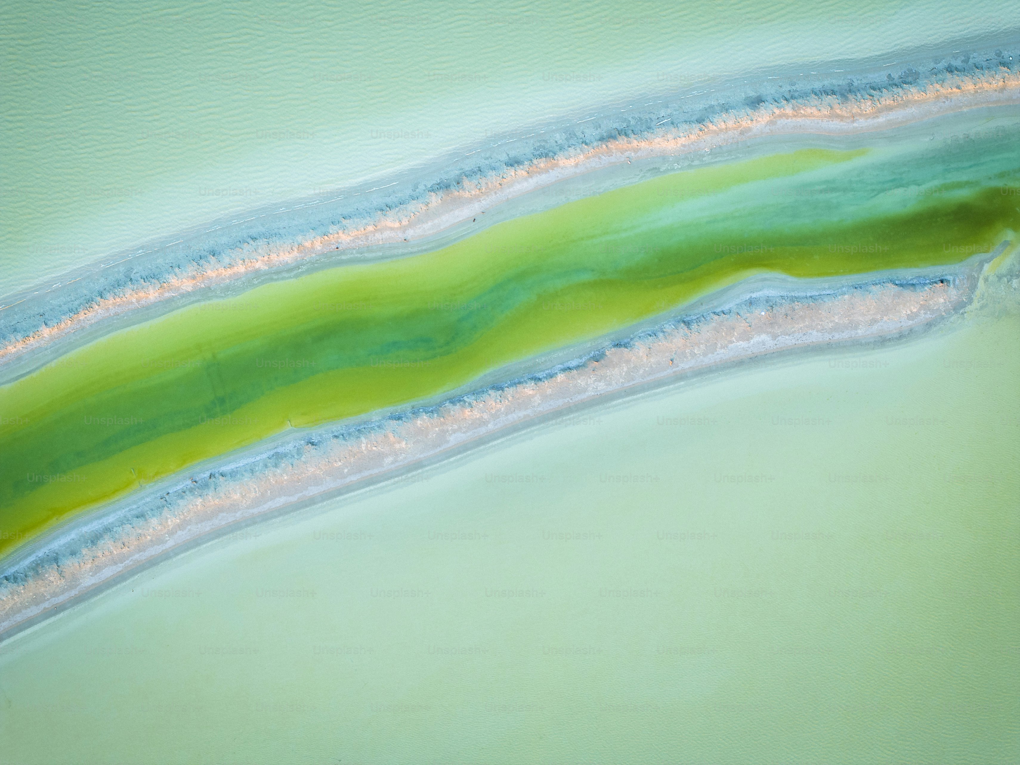 a painting of a green and blue wave