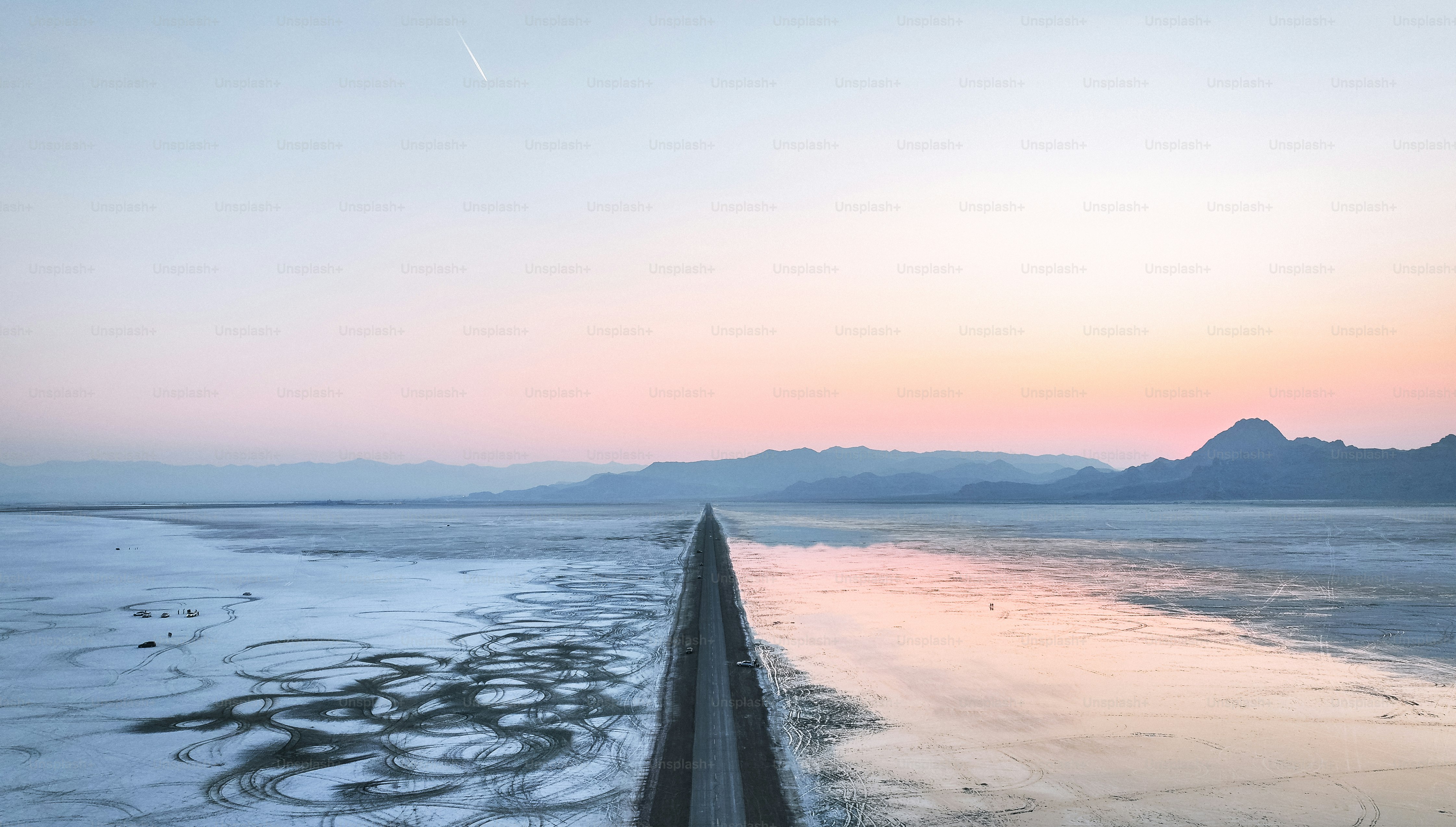 a view of a body of water with mountains in the background