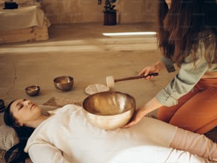 a woman getting a stone massage at a spa
