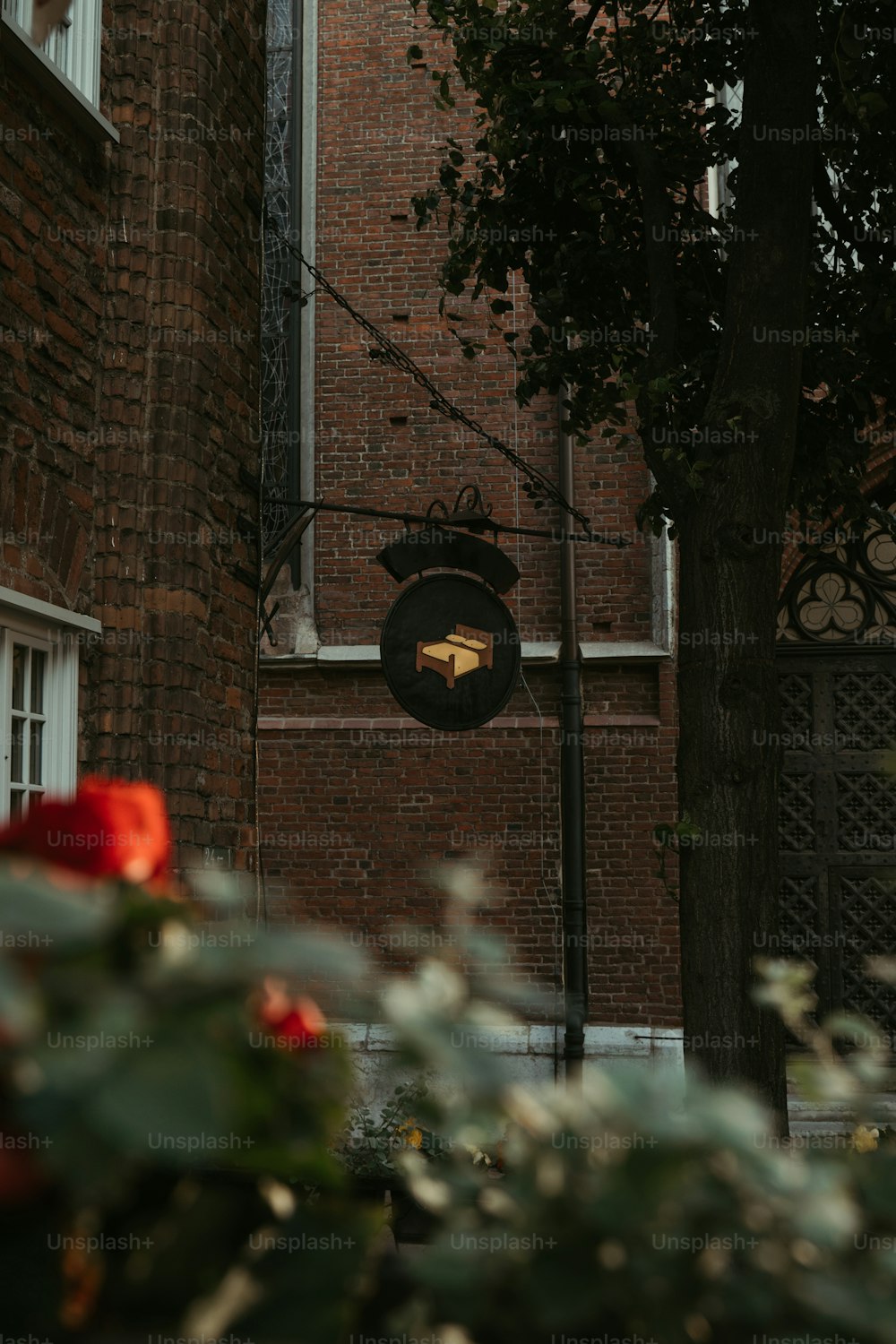 a street sign in front of a brick building