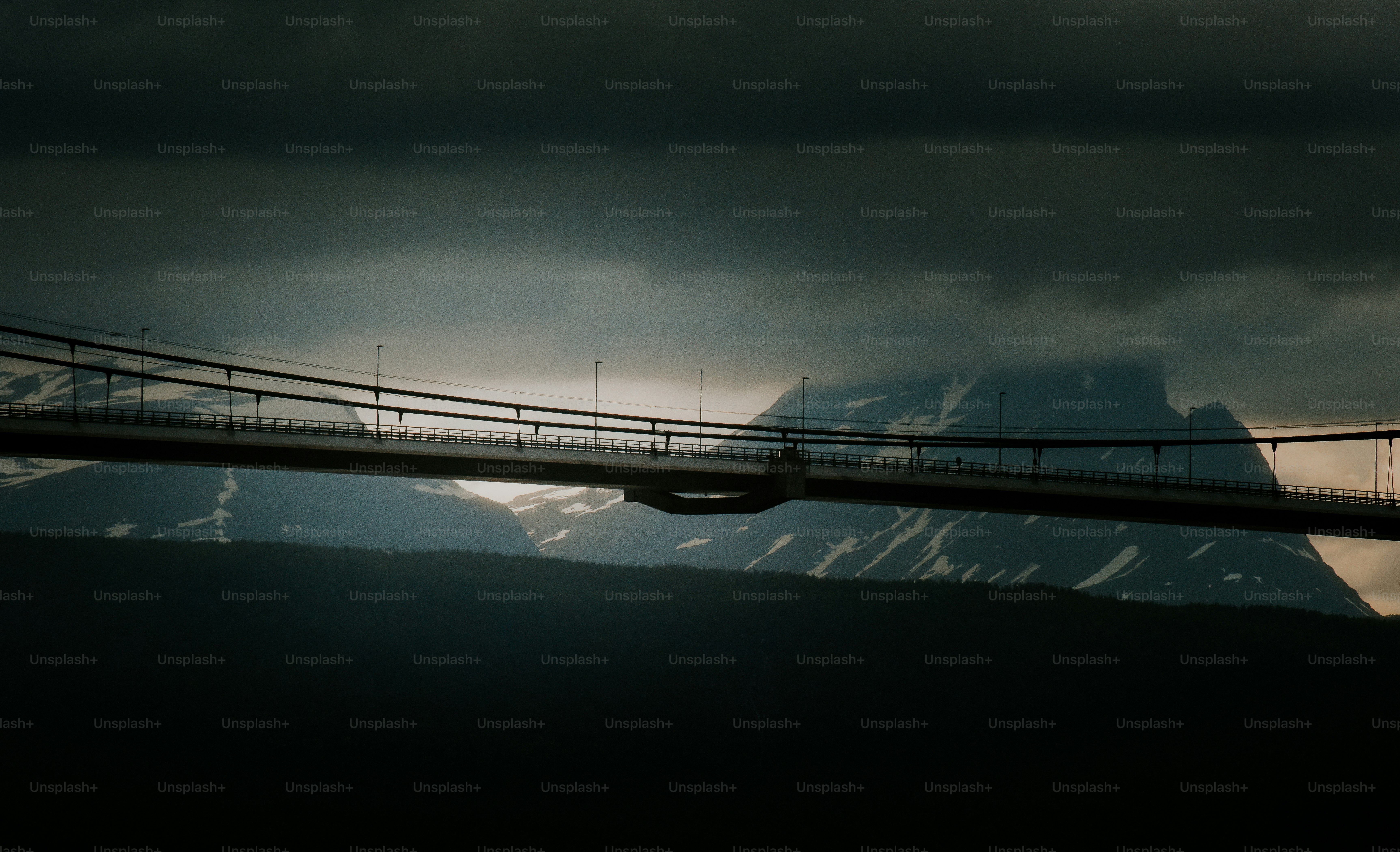 a bridge with a mountain in the background