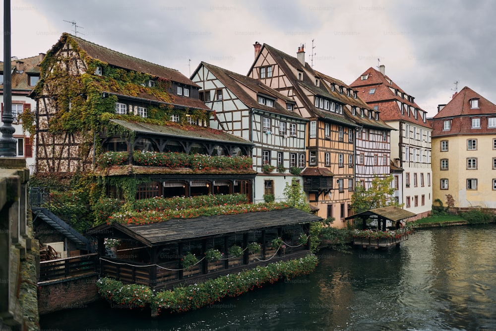 a row of buildings next to a body of water