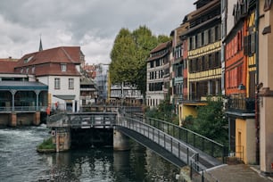 a river running through a city next to tall buildings