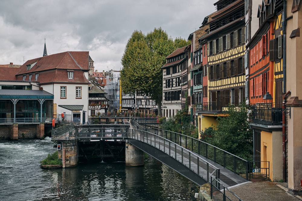 a river running through a city next to tall buildings