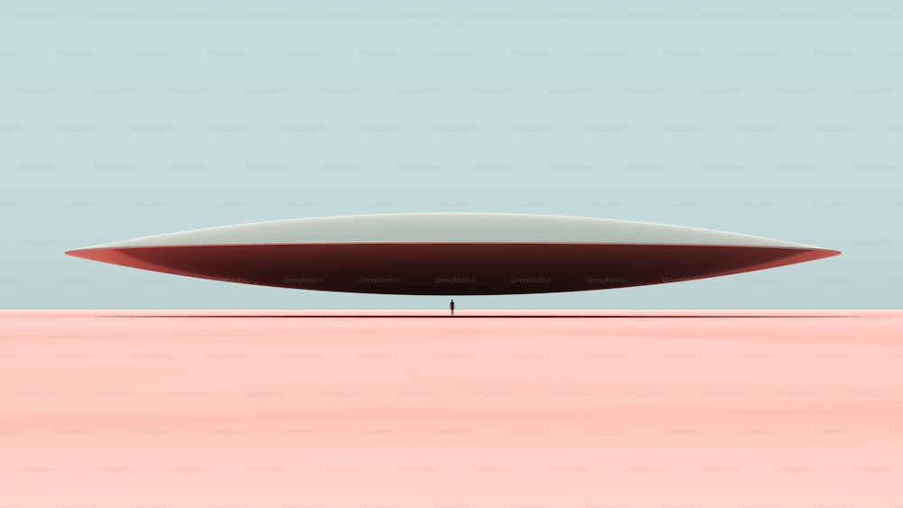 a red and white object sitting in the middle of a desert