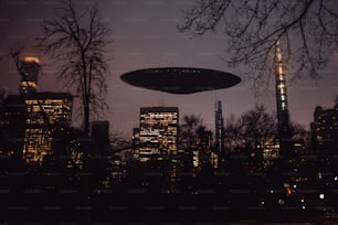 an alien flying over a city at night
