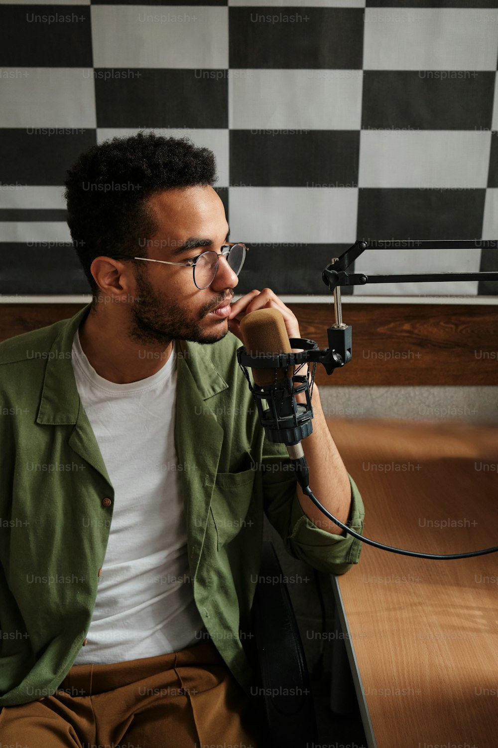 a man sitting down talking on a cell phone