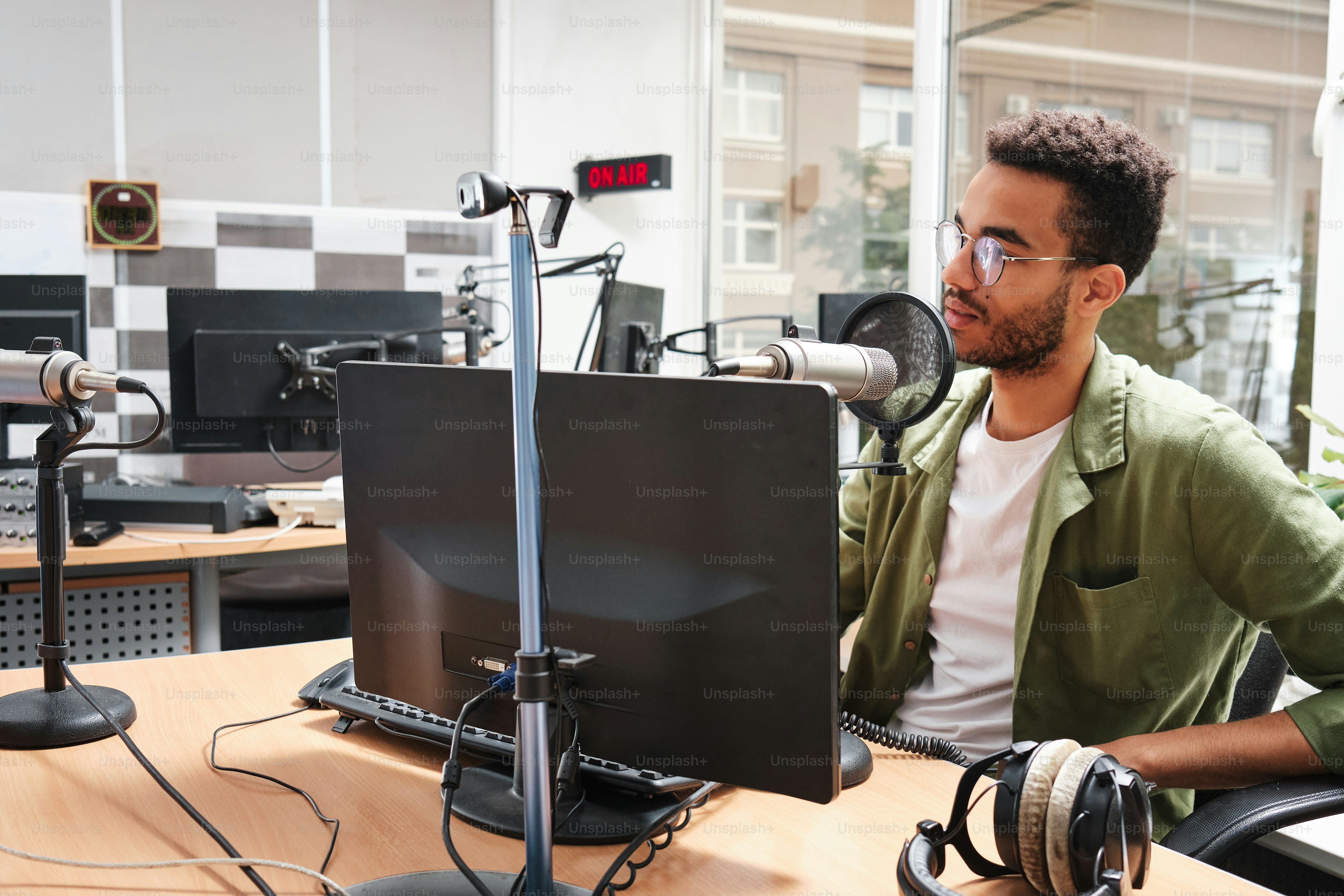 a man sitting at a desk in front of a computer