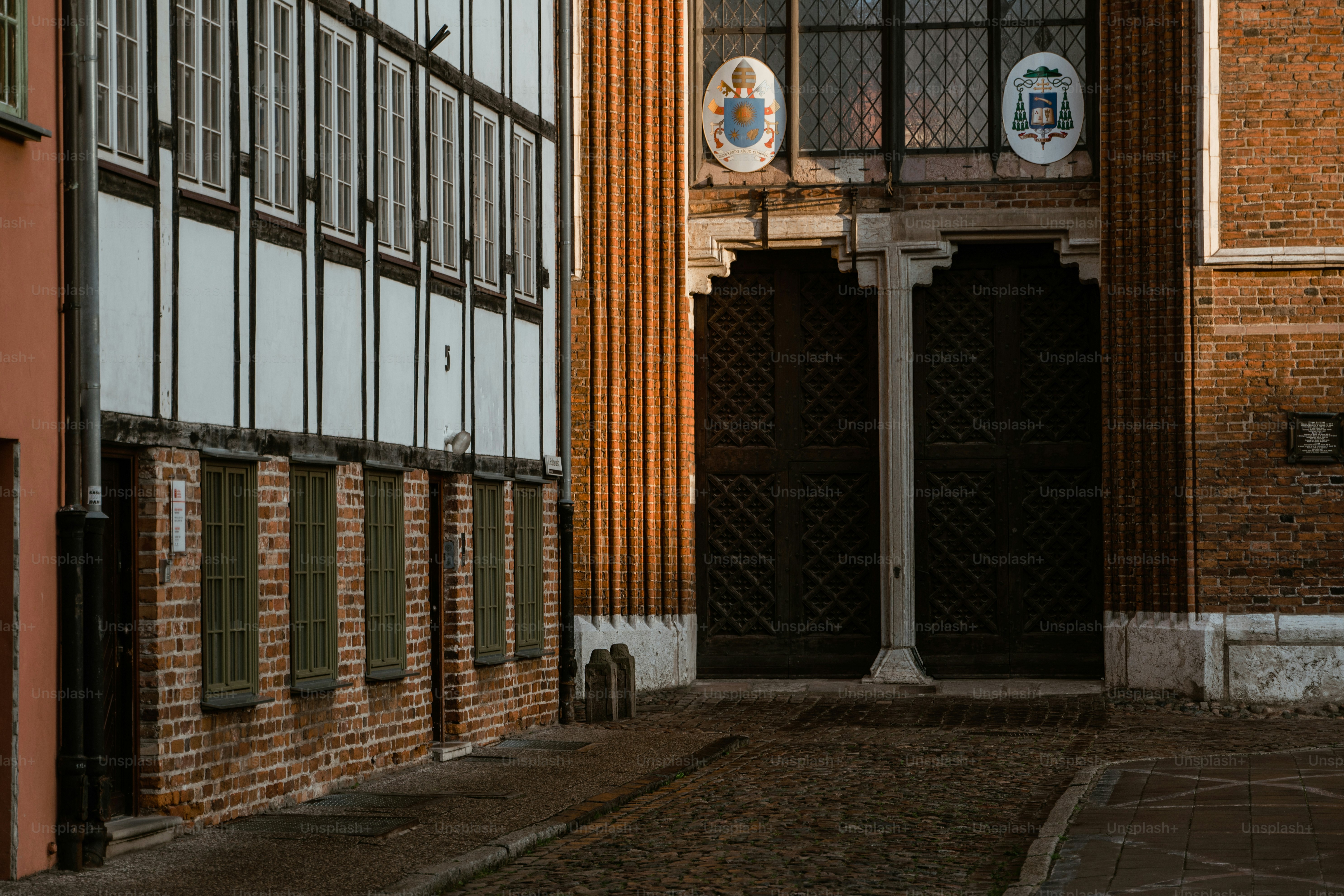 a brick building with a clock on the side of it