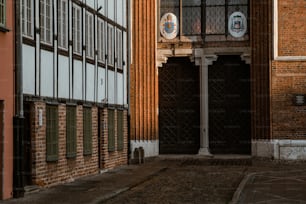 a brick building with a clock on the side of it