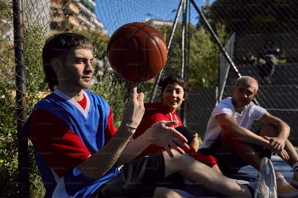 a group of young men playing a game of basketball