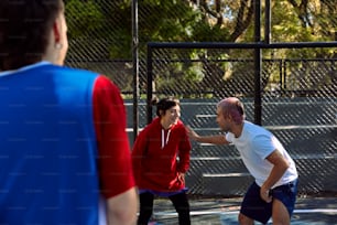 a group of people playing a game of tennis