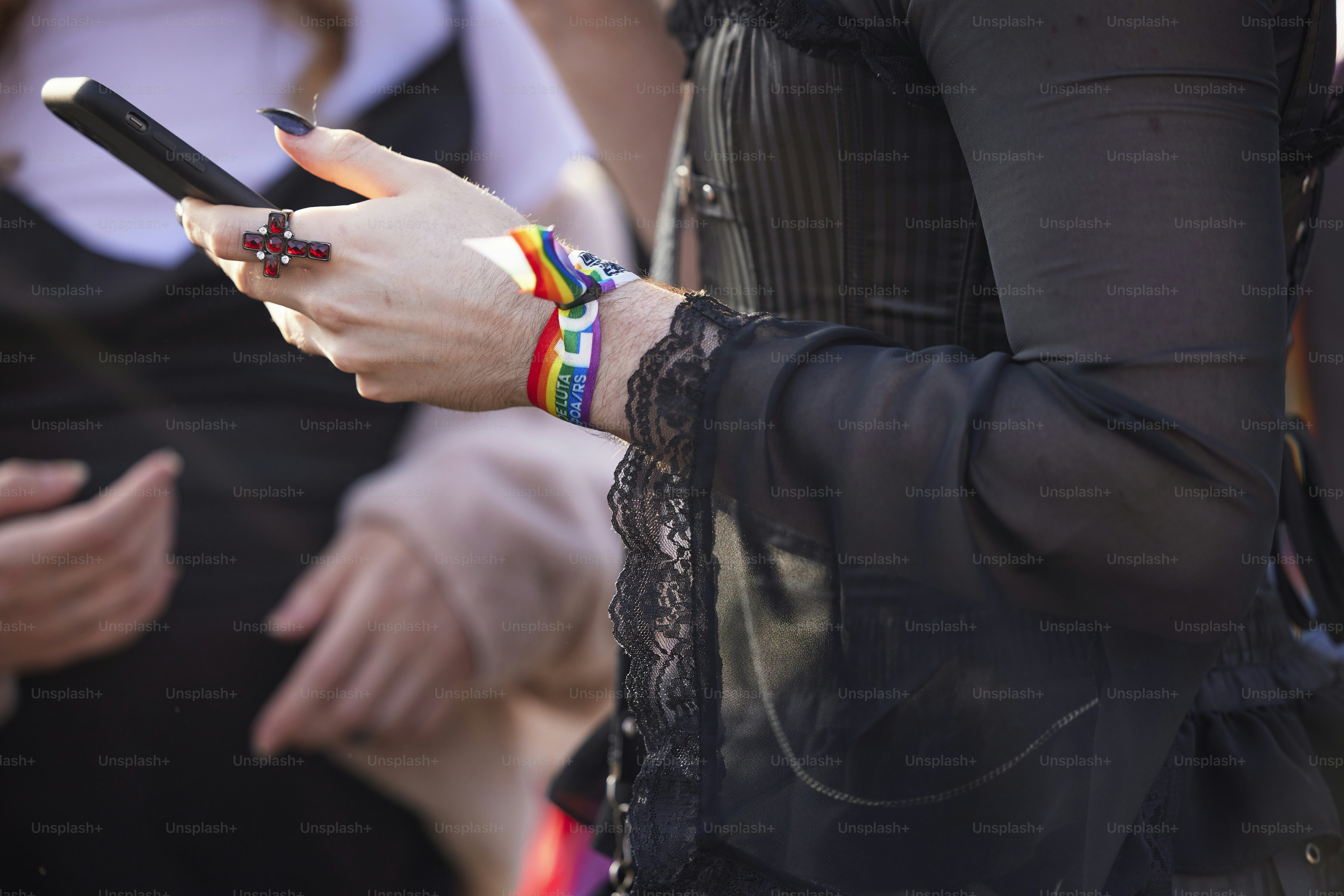 a close up of a person holding a cell phone