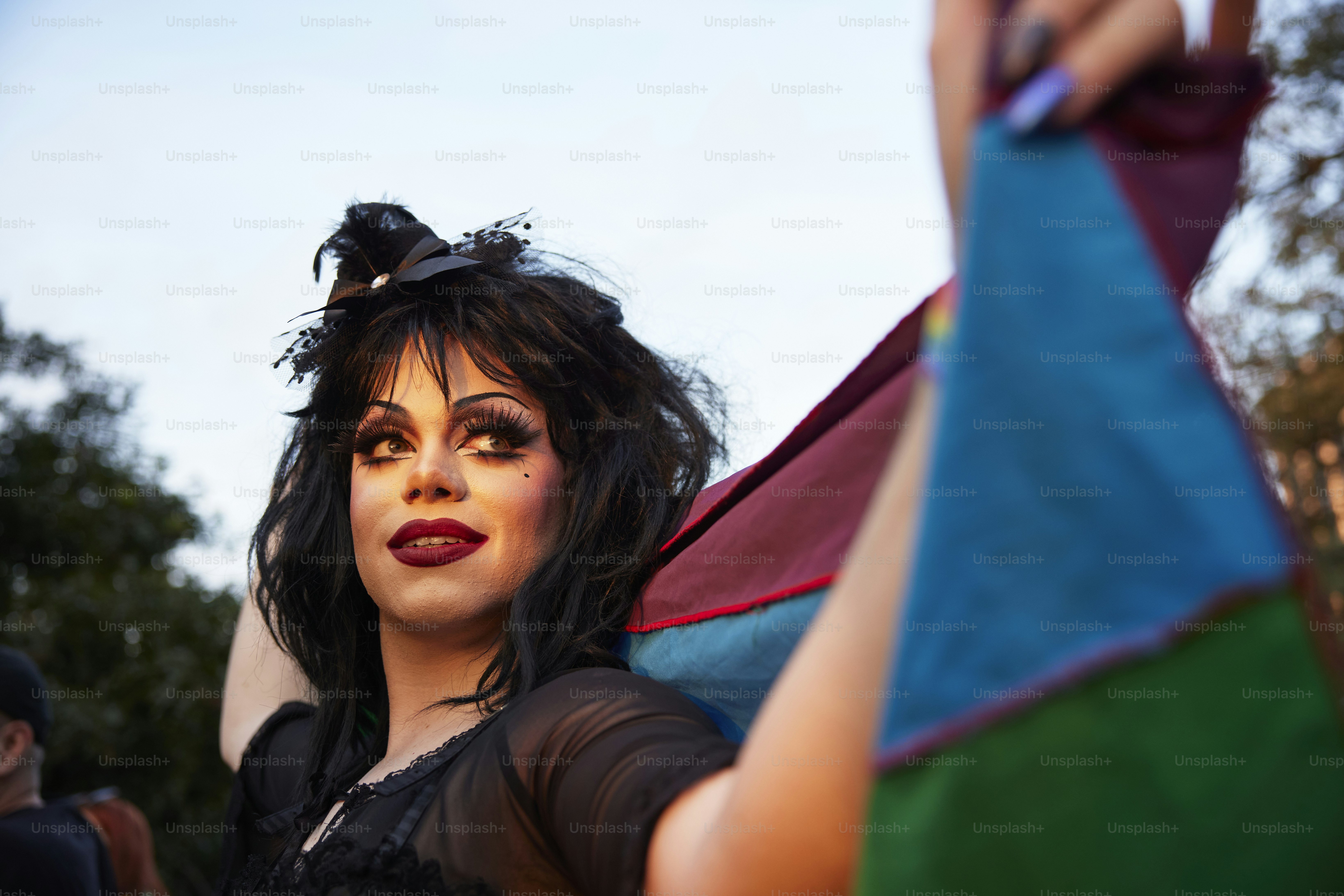 a woman in a costume holding a kite