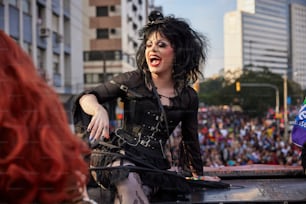 a woman in a black outfit on a stage