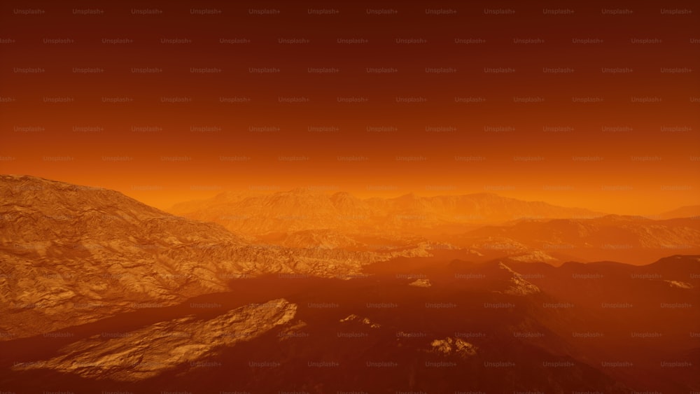 une vue d’une chaîne de montagnes avec un ciel rouge en arrière-plan