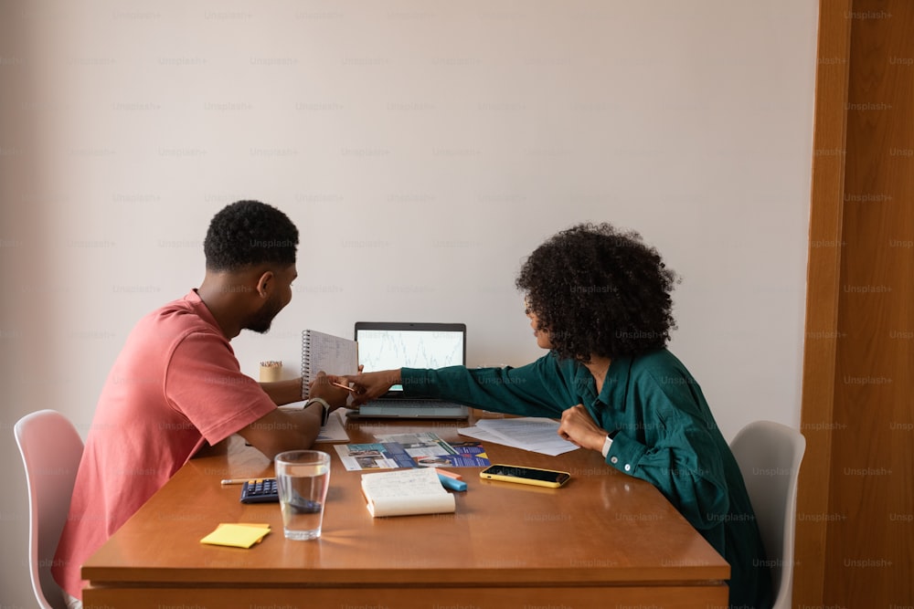 a man and a woman sitting at a table