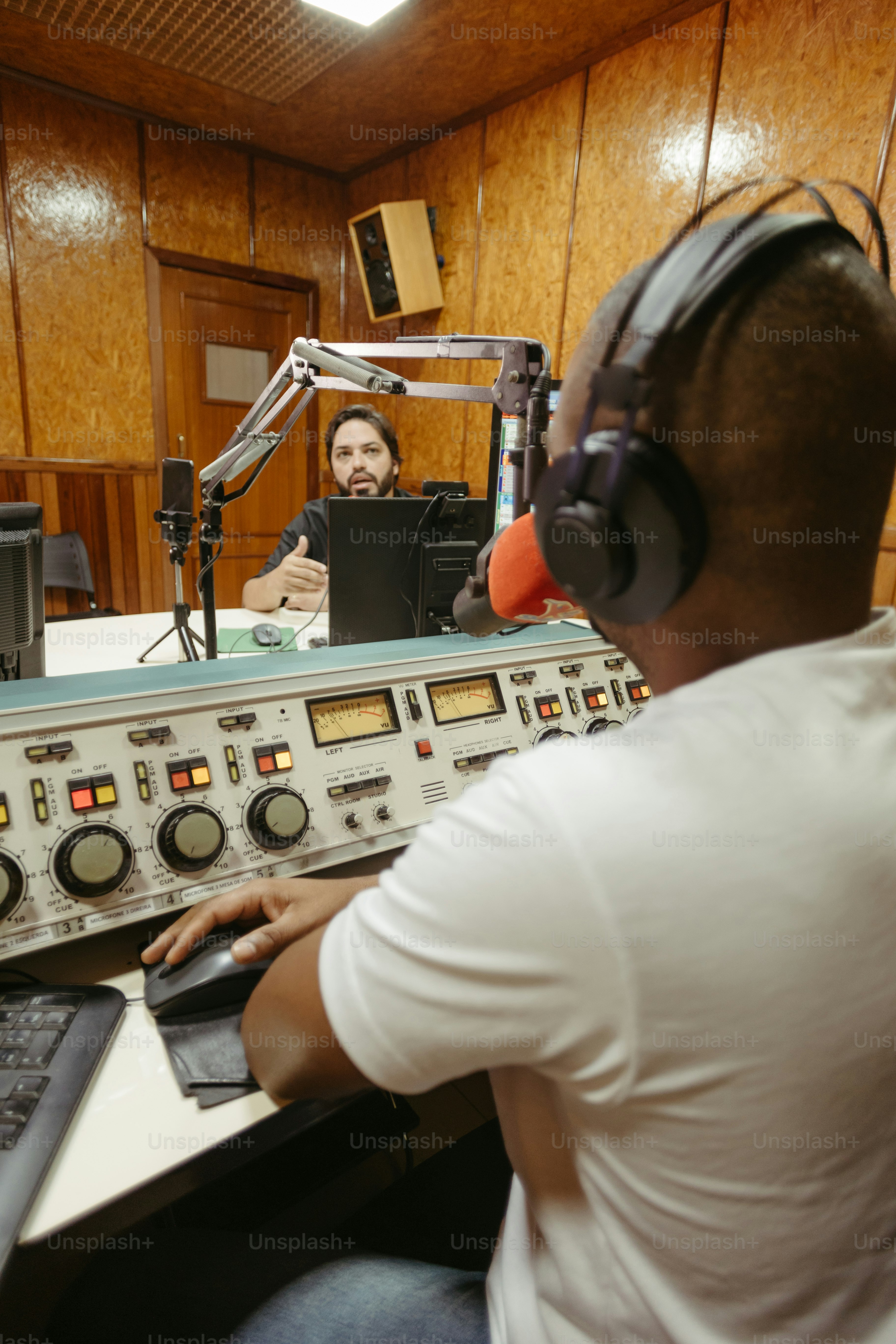 a man sitting in front of a laptop computer