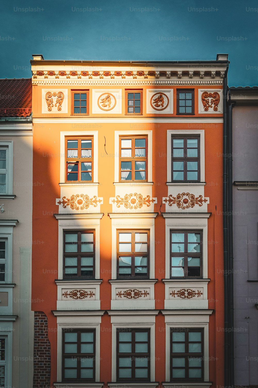 a tall building with a clock on the side of it