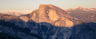 a view of the top of a mountain in the sun