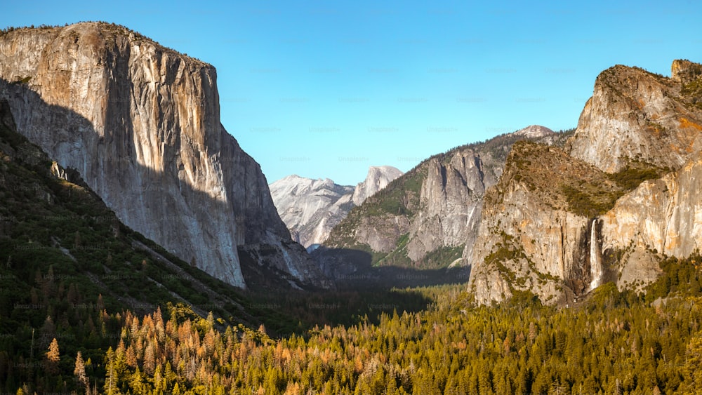 a view of a valley with mountains in the background