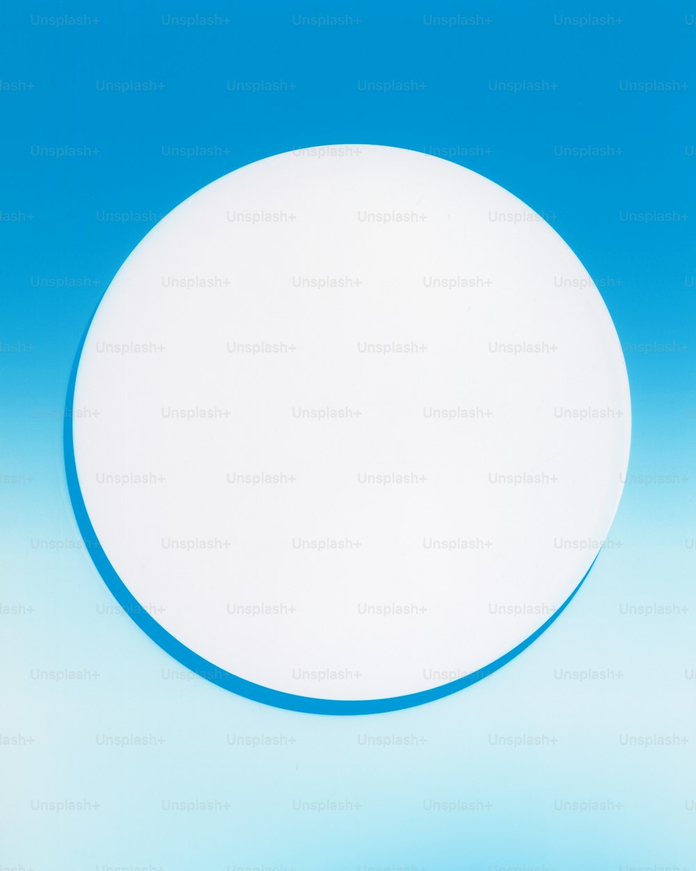 a white circular object against a blue background