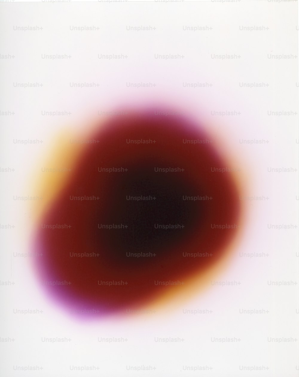 a red and yellow circle on a white background