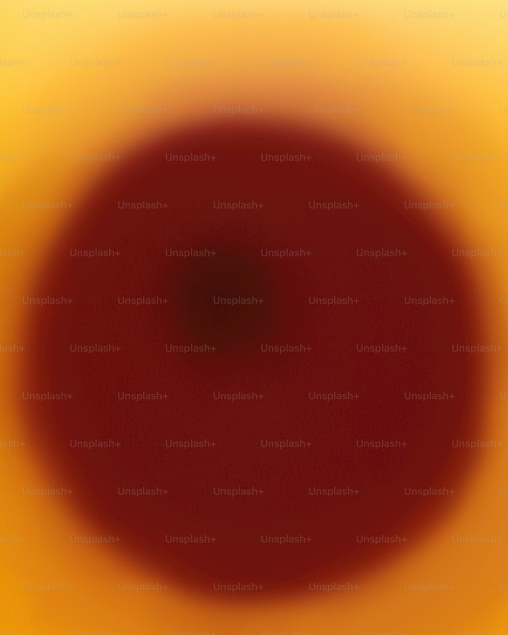 ein verschwommenes Bild eines roten Kreises auf gelbem Hintergrund