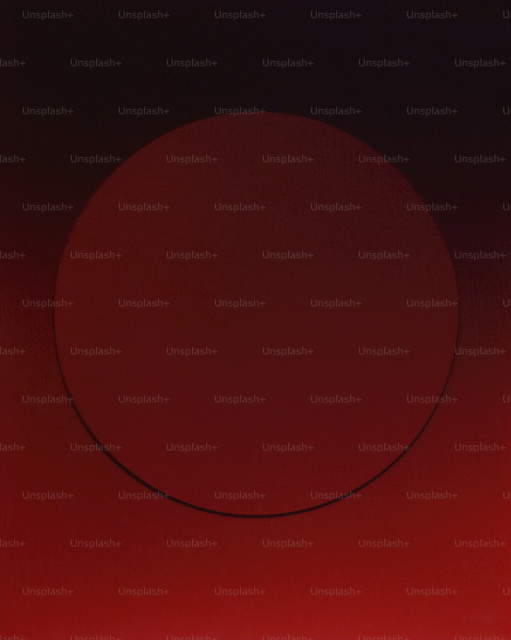 a red circle on a black background