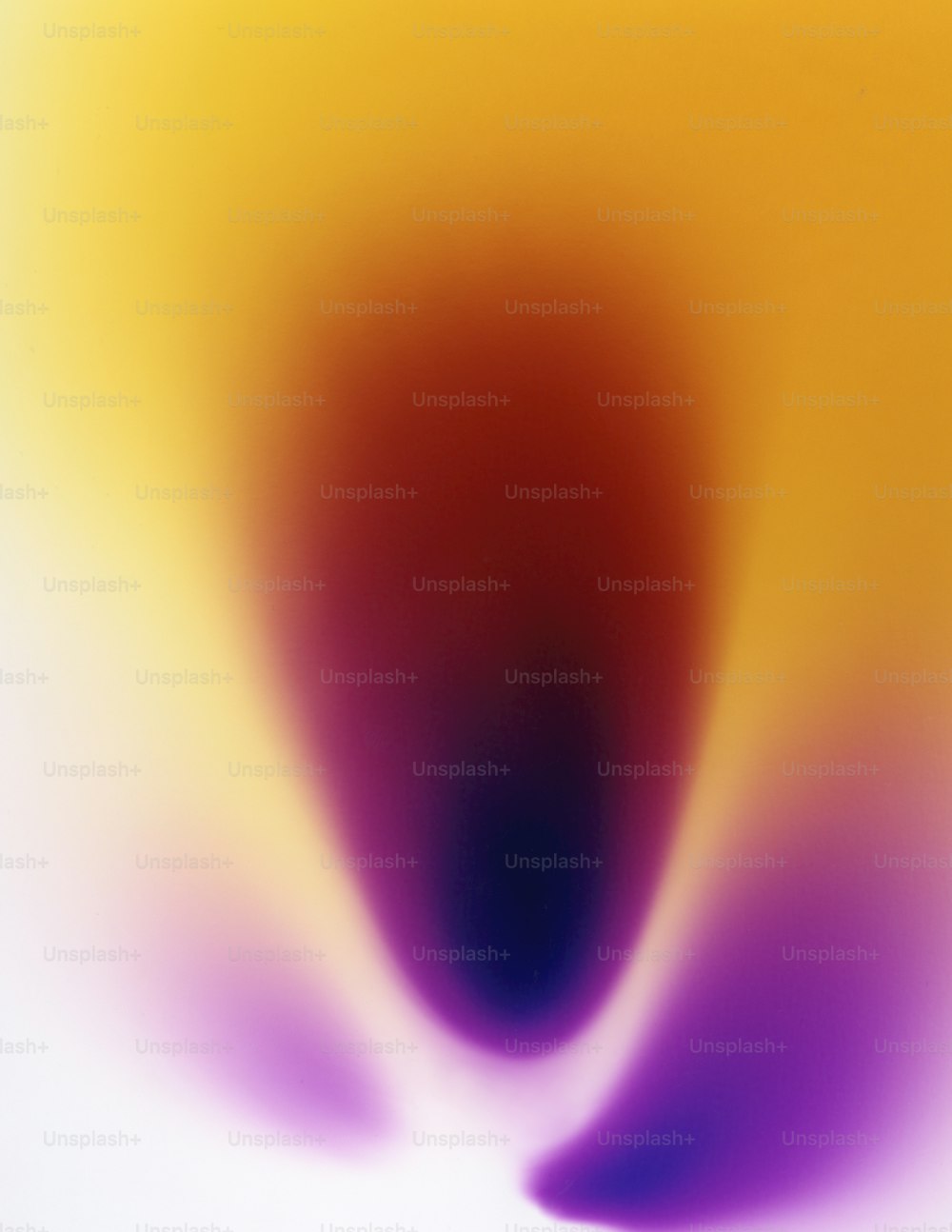 a blurry image of a yellow and purple object