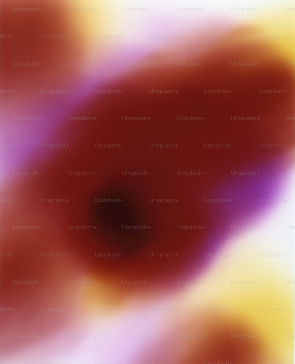 a blurry image of a red and yellow object