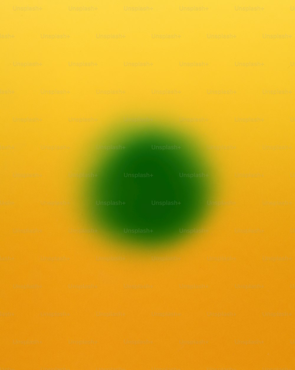 a green circle on a yellow background