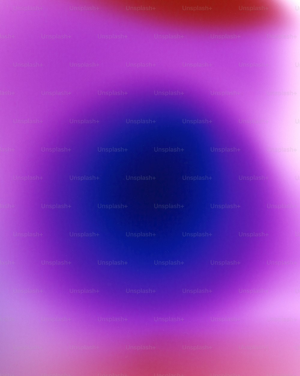 a blurry image of a red and blue circle