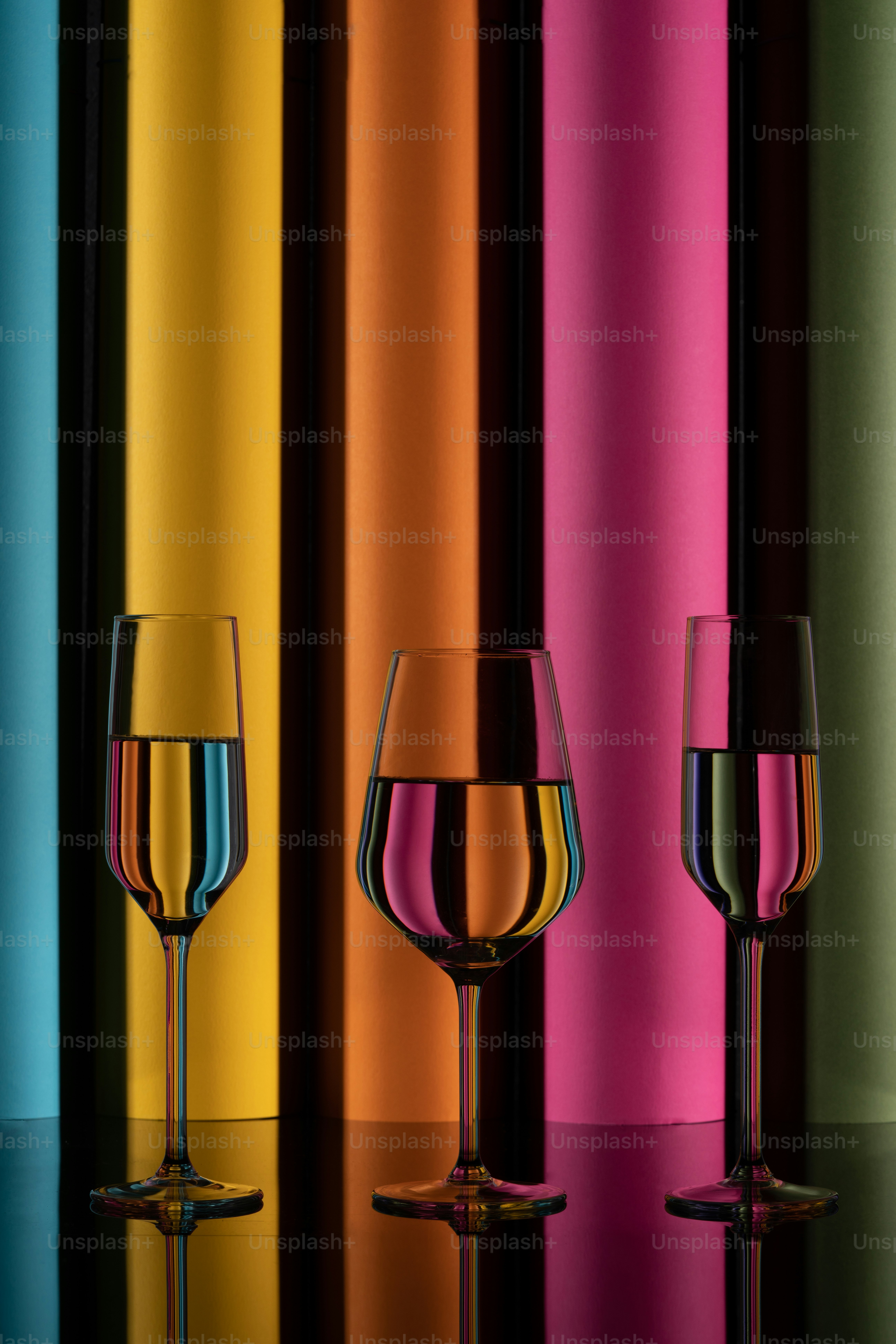 a couple of wine glasses sitting on top of a table