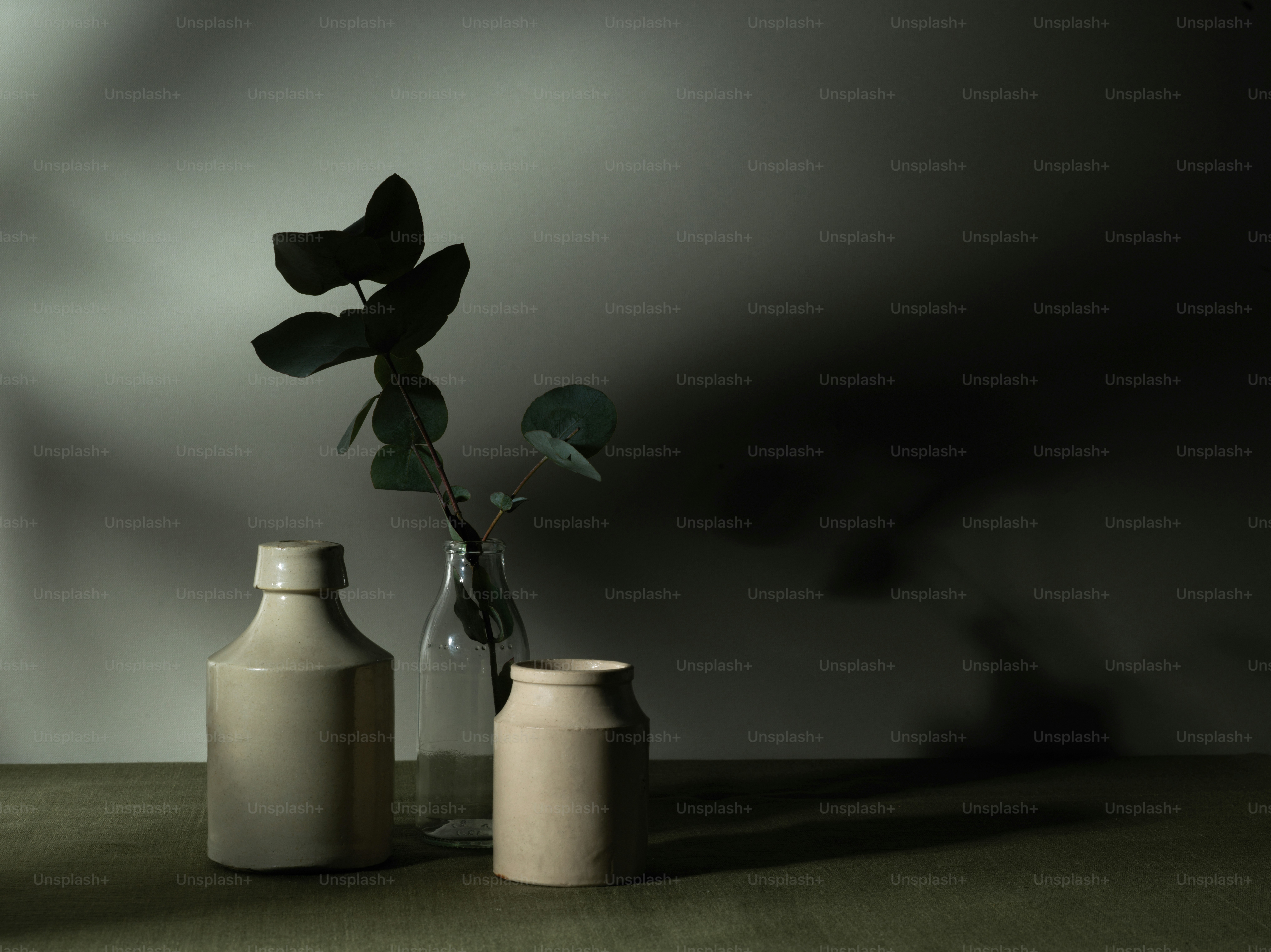 a couple of vases sitting on top of a table