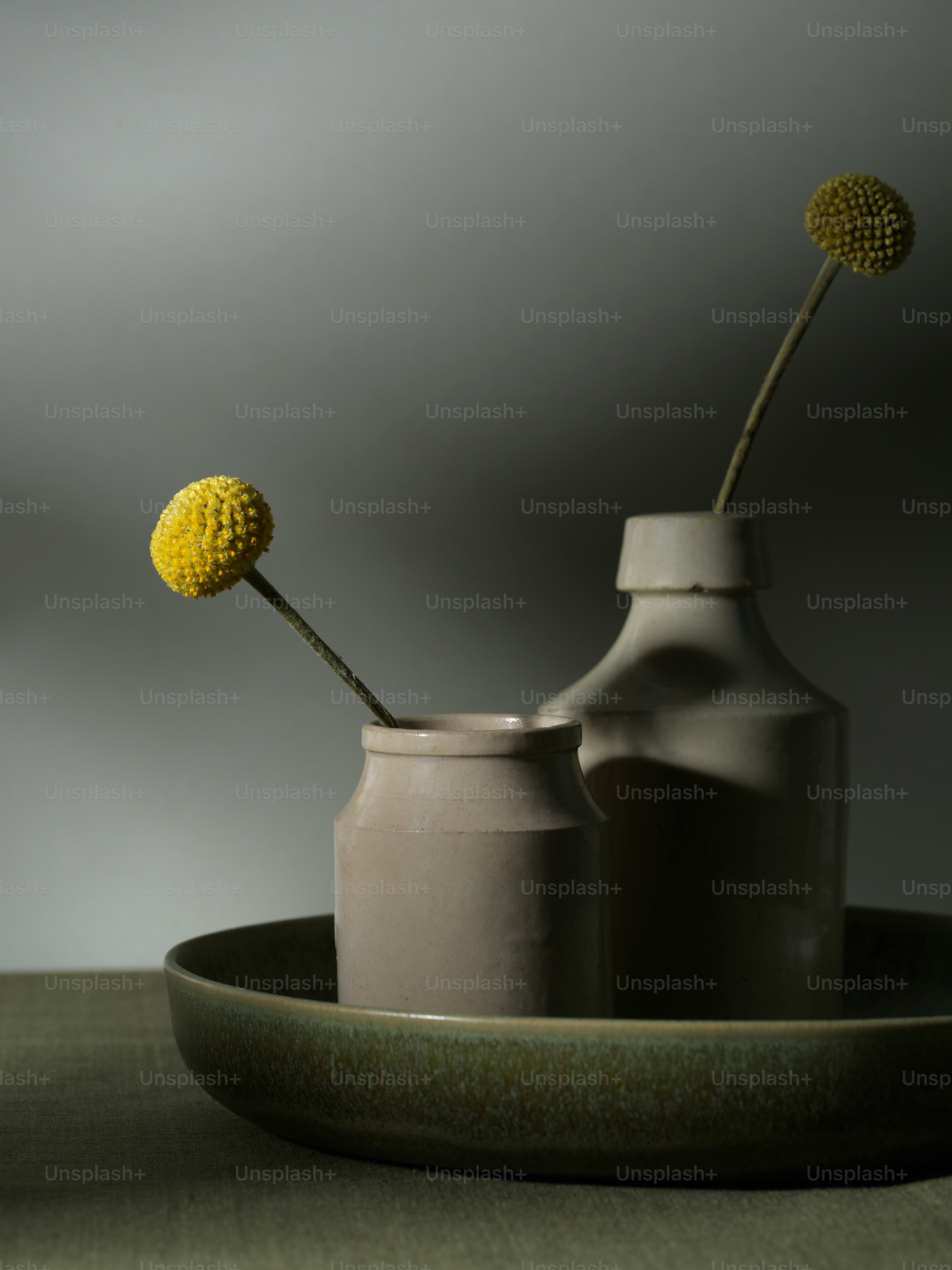 a couple of vases sitting on top of a table