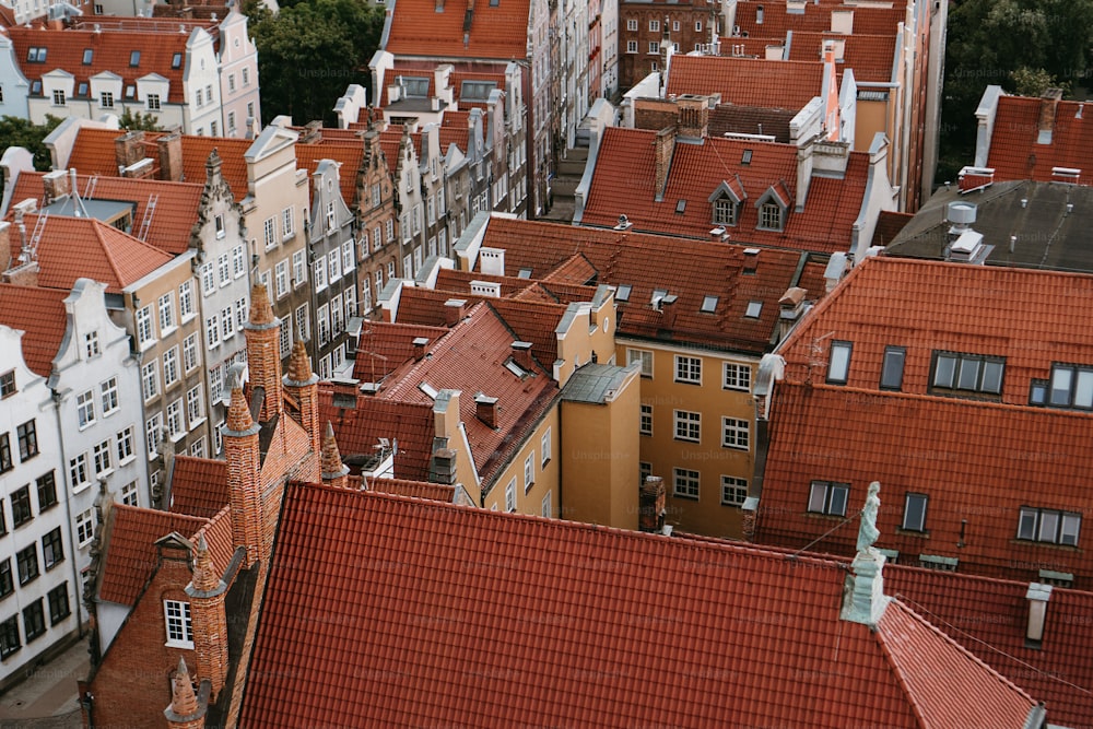 an aerial view of a city with red roofs