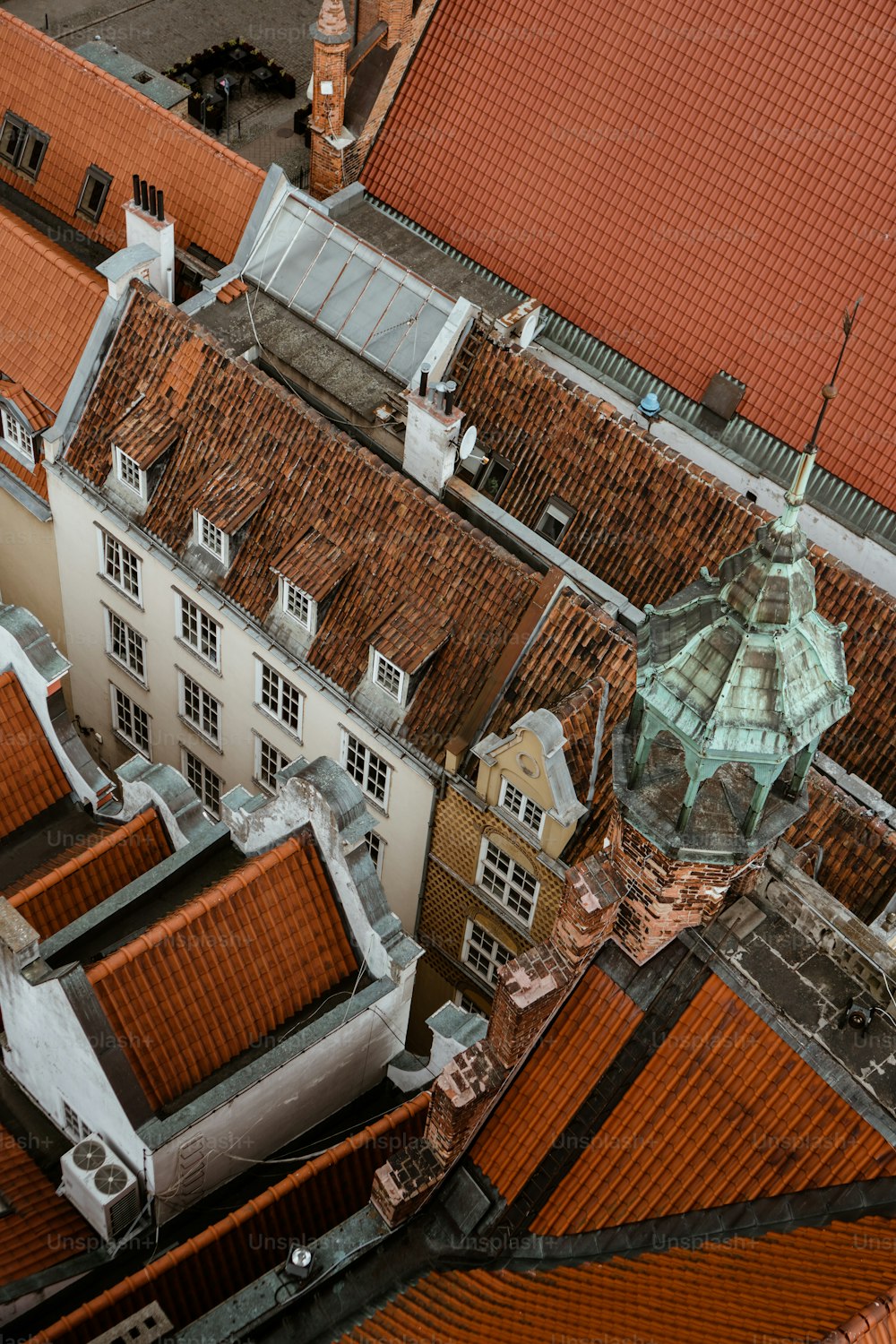 a bird's eye view of rooftops and buildings