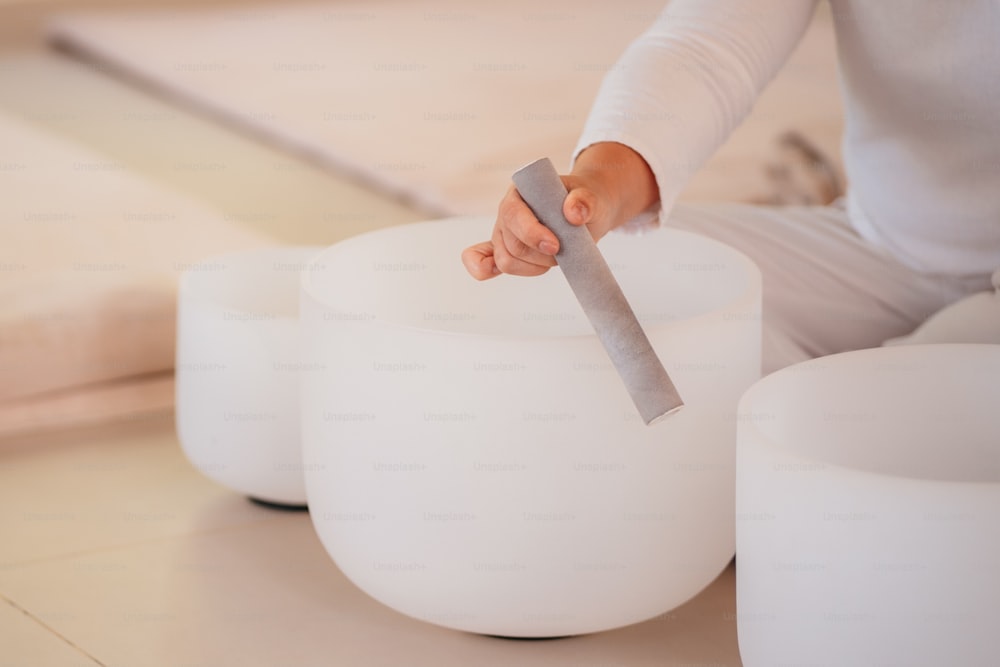 a person sitting on a stool with a knife sticking out of it