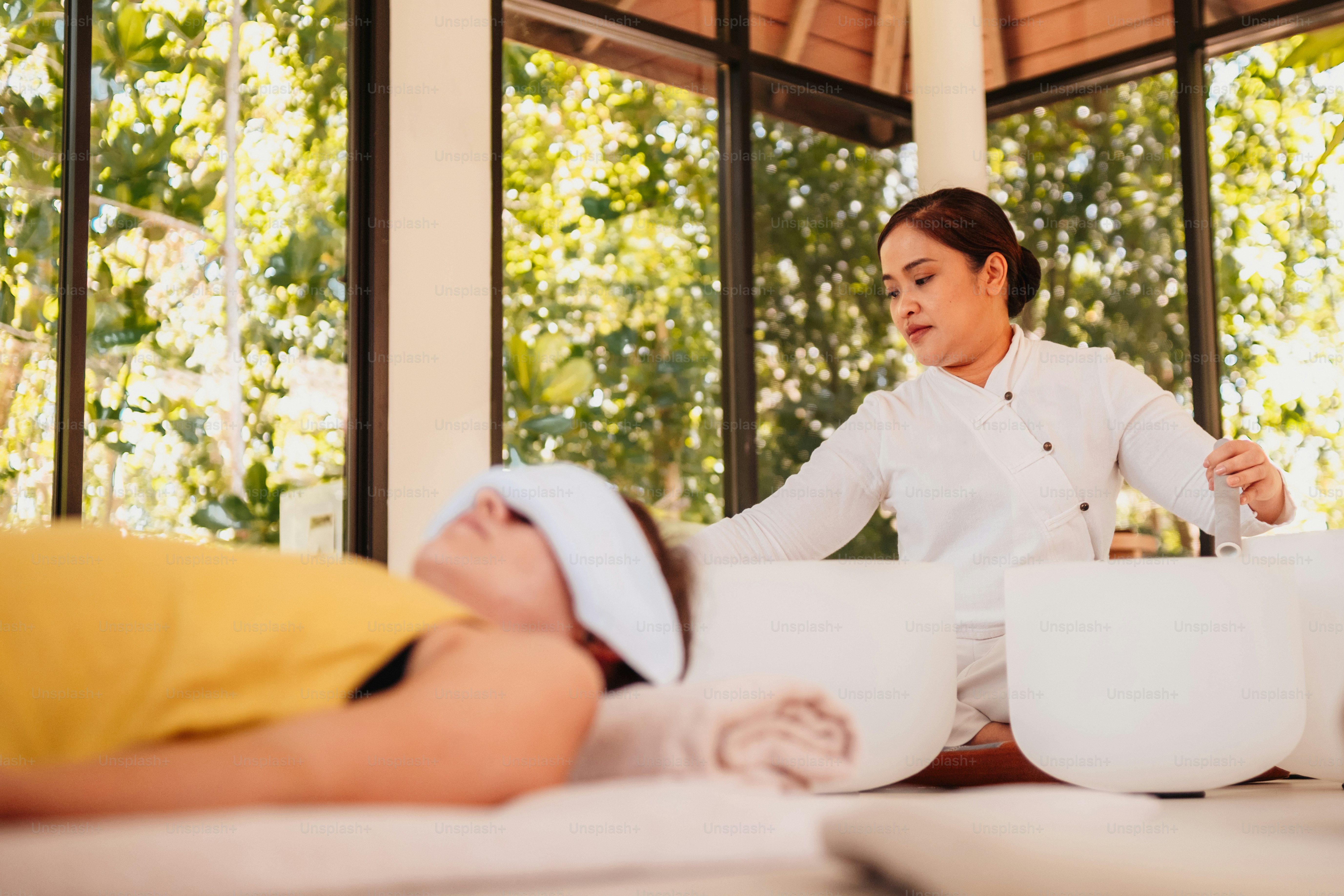 a woman getting a back massage at a spa
