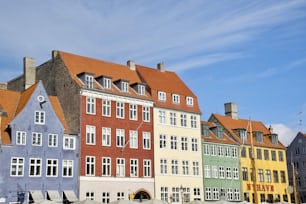 a row of colorful buildings on a sunny day